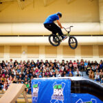 BMX rider performing aerial stunt on ramp at Go Big BMX Air Show